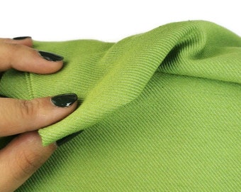 Groene denimstof op maat gesneden, jeanskatoen, jeansstof,