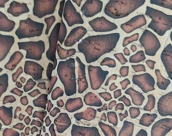 May include: Close-up of a brown and beige cork fabric with a giraffe print pattern.