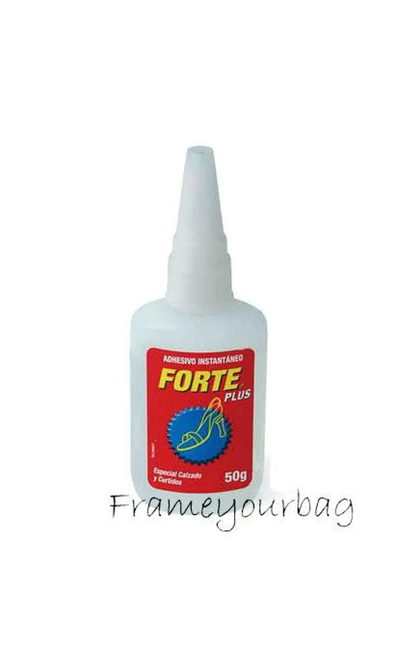 May include: A clear plastic bottle of Forte Plus instant adhesive, labelled "Adhesivo Instantaneo Forte Plus". The bottle is red and white with a picture of a red shoe on it. The bottle is 50g.
