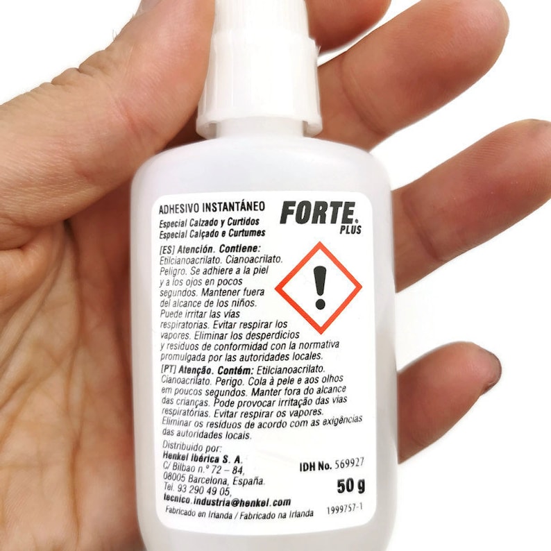 May include: A white bottle of Forte Plus instant adhesive, labelled for use on footwear and leather. The bottle contains 50 grams of adhesive and has a warning label with an exclamation point.