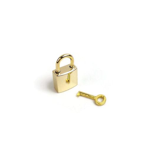 Louis Vuitton Gold Tone Purse Padlock, France Auction