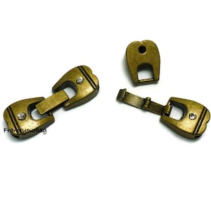 2 Zamakspangen Antikmessing für Leder ø 12 x 3 mm-Zk492