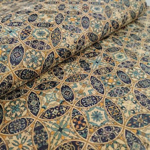 May include: A cork fabric with a repeating pattern of blue, yellow, and white geometric shapes. The fabric has a textured surface and a vintage look.