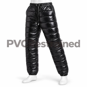 May include: Black quilted trousers with a shiny, high-gloss finish. These trousers feature horizontal baffle stitching, an elasticated waistband with a black drawstring, and elasticated cuffs at the ankles. The garment is displayed on a mannequin.