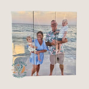 May include: A square photo collage composed of nine individual tiles displaying a family on a beach at sunset. The image features a person in a blue dress holding a child, and another person in a floral shirt holding a child. Teal Creek Creations logo.
