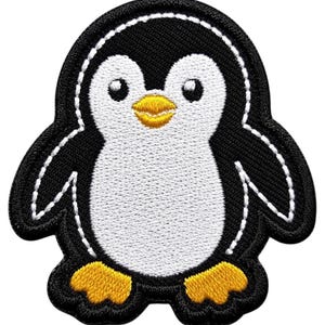 May include: An embroidered patch featuring a cartoon penguin with a black body, white chest, and face. The penguin has a bright yellow beak and matching yellow webbed feet. The design is outlined with white stitching on a black background.