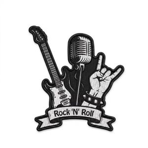 May include: A black and white embroidered patch featuring an electric guitar, a vintage-style microphone, and a hand making a rock and roll gesture. A banner at the bottom displays the text Rock 'N' Roll in a bold, black font on a white background.