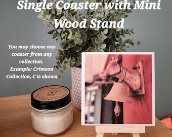 May include: A square coaster featuring a photograph of a horse head sculpture with a bell, displayed on a light-colored wooden mini stand. The text reads: Single Coaster with Mini Wood Stand. You may choose any coaster from any collection. Example: Crimson Collection, C is shown.