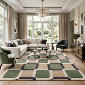 May include: A large area rug featuring a repeating geometric pattern of rounded squares in shades of sage green, tan, and dark charcoal gray, set against a cream-colored background, covering the floor of a living room space.