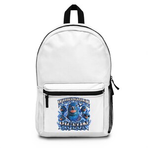 May include: A white backpack featuring a graphic print on the front pocket. The print displays multiple blue pigeons with human-like lips, surrounded by blue feathers and the text "WHISPERING PIGEON" in a metallic blue, stylized font.