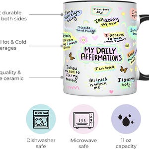 May include: White ceramic mug with a black handle and rim, featuring colorful affirmations like "I am loved" and "I love my body." The mug has a capacity of 11 oz and is dishwasher and microwave safe.