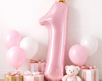 May include: A pink number one balloon with a gold crown, surrounded by pink and white balloons, wrapped gifts, and a teddy bear. A festive scene for a first birthday celebration.