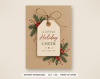 May include: A rectangular kraft paper card featuring a cream-colored gift tag tied with twine. The tag displays the text A LITTLE Holiday CHEER JUST FOR YOU. The design is decorated with illustrations of green pine needles and red berries.