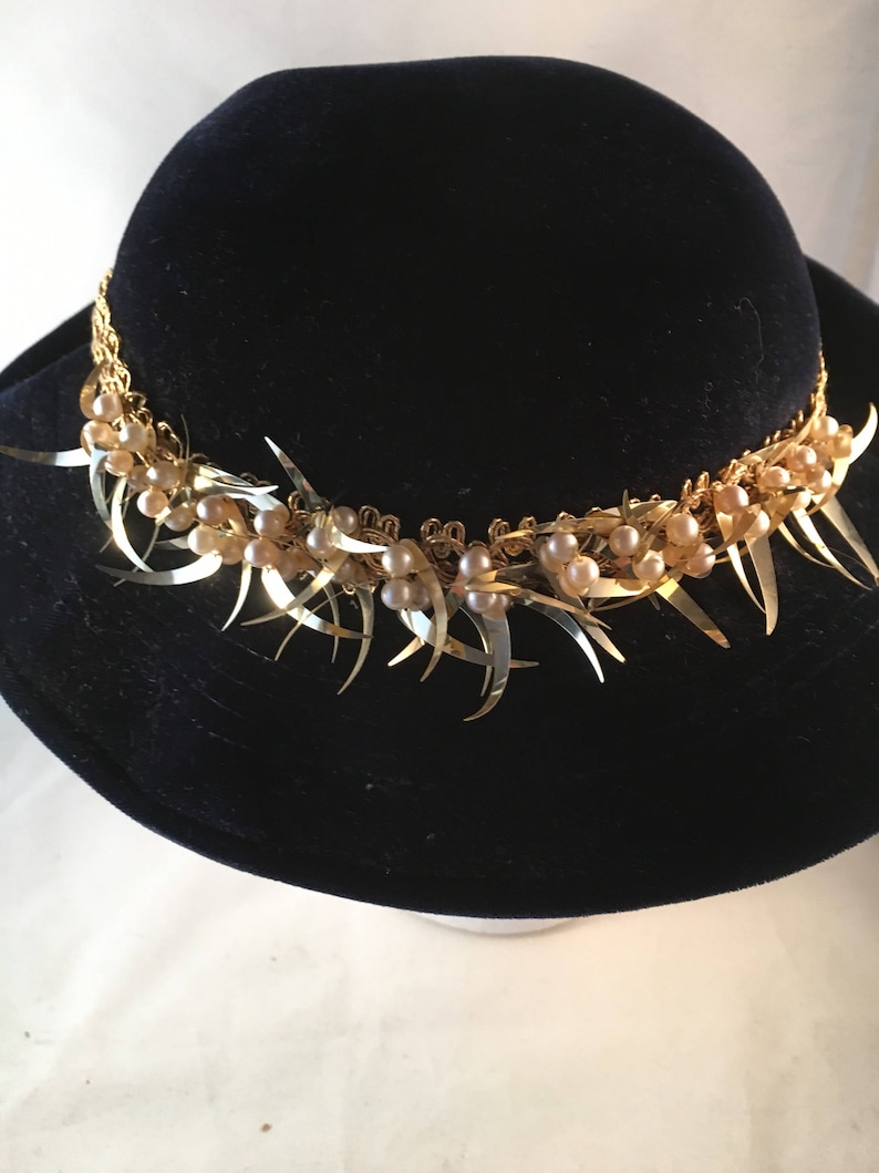 Navy velvet hat with gold and pearl trim