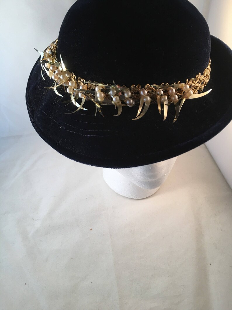 Navy velvet hat with gold and pearl trim