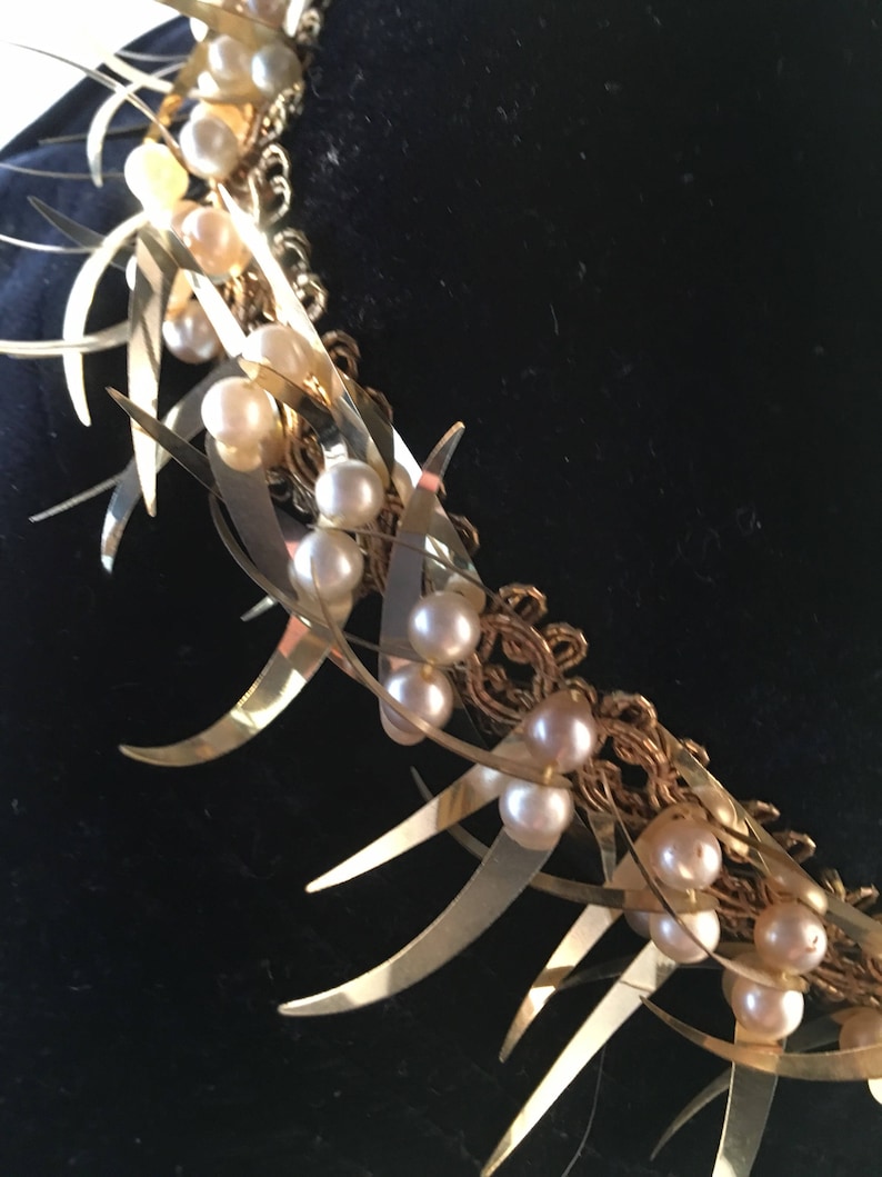 Navy velvet hat with gold and pearl trim