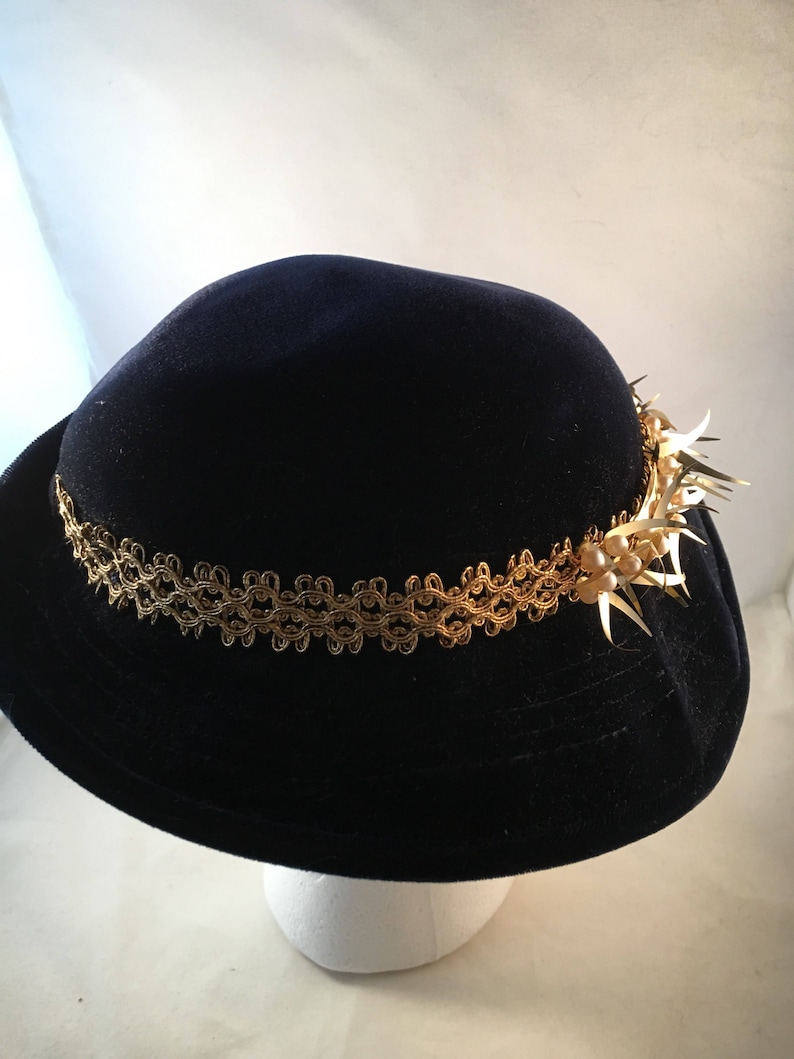 Navy velvet hat with gold and pearl trim