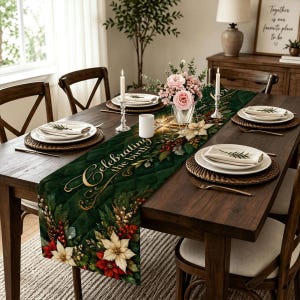 May include: A quilted fabric table runner featuring a dark green background with a gold script text reading Celebrating the birth, accented by illustrations of white and red poinsettias, pine cones, and evergreen branches.