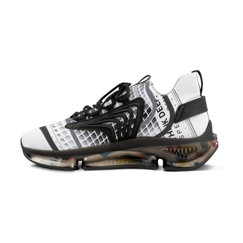 May include: A white trainer with a black grid pattern and black laces. The side features a black structural overlay and the text "THINK DEEP." The sole is black and translucent with a multi-coloured interior, and a black heel strap is attached.