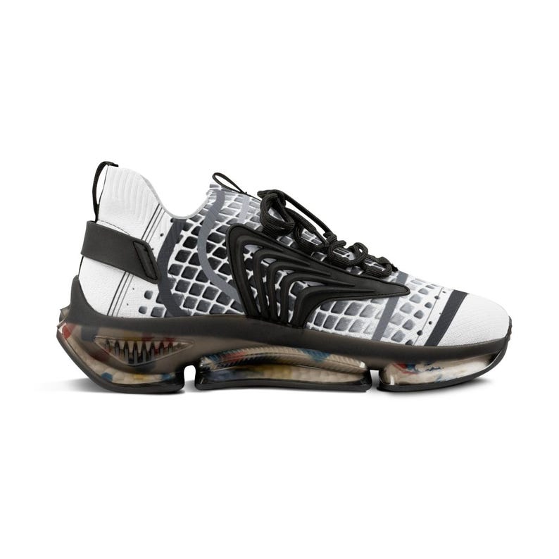 May include: A white trainer featuring a black grid pattern on the side, black laces, and a black structural overlay. The sole is translucent and dark, revealing multi-coloured internal components, with a black heel tab and a textured knit upper.
