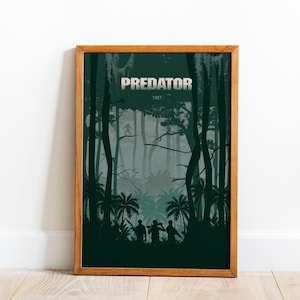 Puede incluir: Un póster rectangular enmarcado que muestra una escena de selva en verde oscuro con las siluetas de tres soldados en la parte inferior y una criatura a lo lejos. El texto PREDATOR y 1987 está impreso en blanco en la parte superior central.