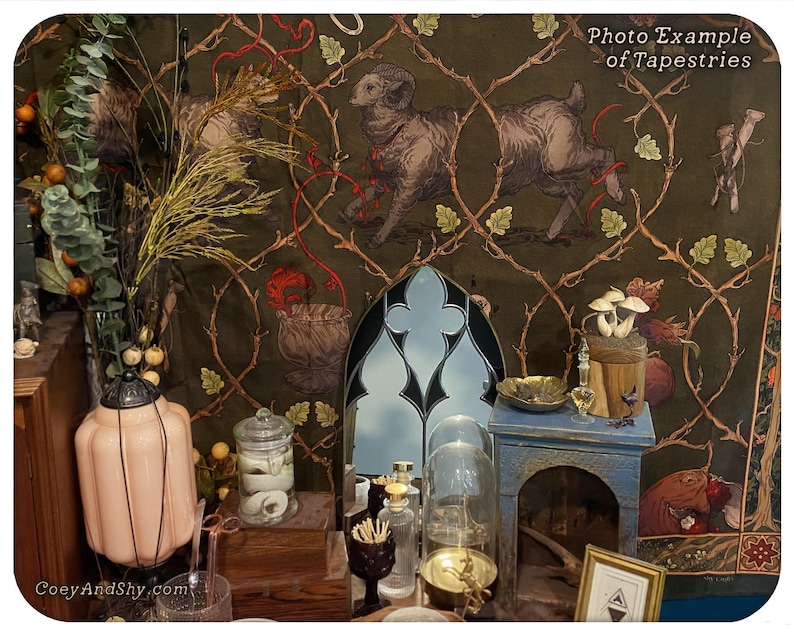 May include: A tapestry with a green background and a repeating pattern of vines and leaves. The tapestry features a ram, a bag, and mushrooms. The tapestry is hanging on a wall with a variety of decorative objects in front of it.