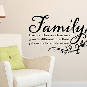 May include: Black and white wall decal with the text "Family" in a decorative font. The text is accompanied by a stylized tree branch design with leaves and a small bird.