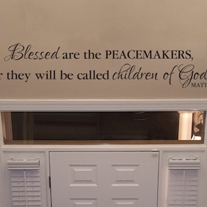 May include: A wall decal with the quote "Blessed are the peacemakers, for they will be called children of God. Matt. 5:9".