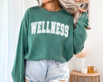 Wellness - Varsity Font - Comfort Colors Pepper - Unisex Garment-Dyed Sweatshirt