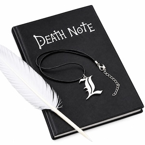May include: A black notebook with the white text DEATH NOTE printed on the cover, accompanied by a white feather quill pen and a silver-toned pendant shaped like the letter L on a black cord necklace with a silver-toned metal clasp and chain.