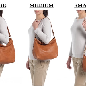 May include: Three tan hobo-style shoulder bags shown in large, medium, and small sizes. Each bag features a smooth, solid-colored exterior, a single shoulder strap attached with metal rings, and a zippered top closure. The text labels LARGE, MEDIUM, and SMALL appear above each respective bag size.