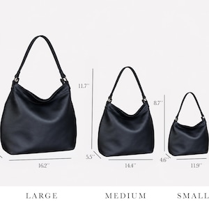 May include: Three black hobo bags in large, medium, and small sizes. The large bag measures 13 inches high, 16.2 inches wide, and 5.6 inches deep. The medium bag is 11.7 inches high, 14.4 inches wide, and 5.5 inches deep. The small bag is 8.7 inches high, 11.9 inches wide, and 4.6 inches deep.