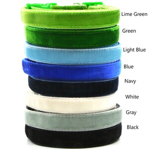 May include: A stack of eight velvet cat collars in various colors, including lime green, green, light blue, blue, navy, white, gray, and black.