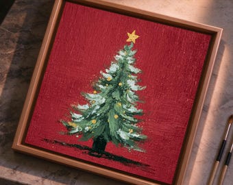 May include: A square framed painting featuring a green Christmas tree with white snow-like highlights and yellow ornaments on a textured deep red background, topped with a yellow star, set in a light-coloured wooden frame.
