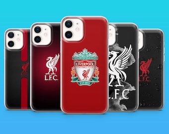 May include: Five smartphone cases featuring Liverpool Football Club branding. Designs include a red case with the club crest, a dark red case with the L.F.C. logo, a black case with a red stripe, a black case with a white bird logo, and a black case with water droplets.