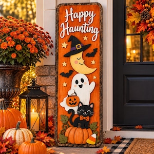 May include: A tall rectangular wooden sign with an orange background featuring the text Happy Haunting in white script. The sign displays a crescent moon wearing a witch hat, a white ghost holding a jack-o'-lantern, a black cat, and pumpkins.