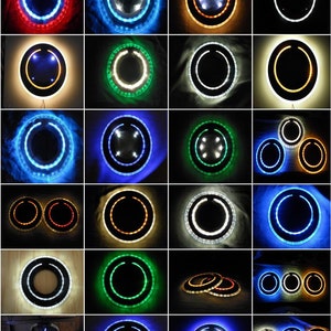 May include: A collection of round mirrors with different colored LED lights around the perimeter. The mirrors are various sizes and some have a double ring of lights.
