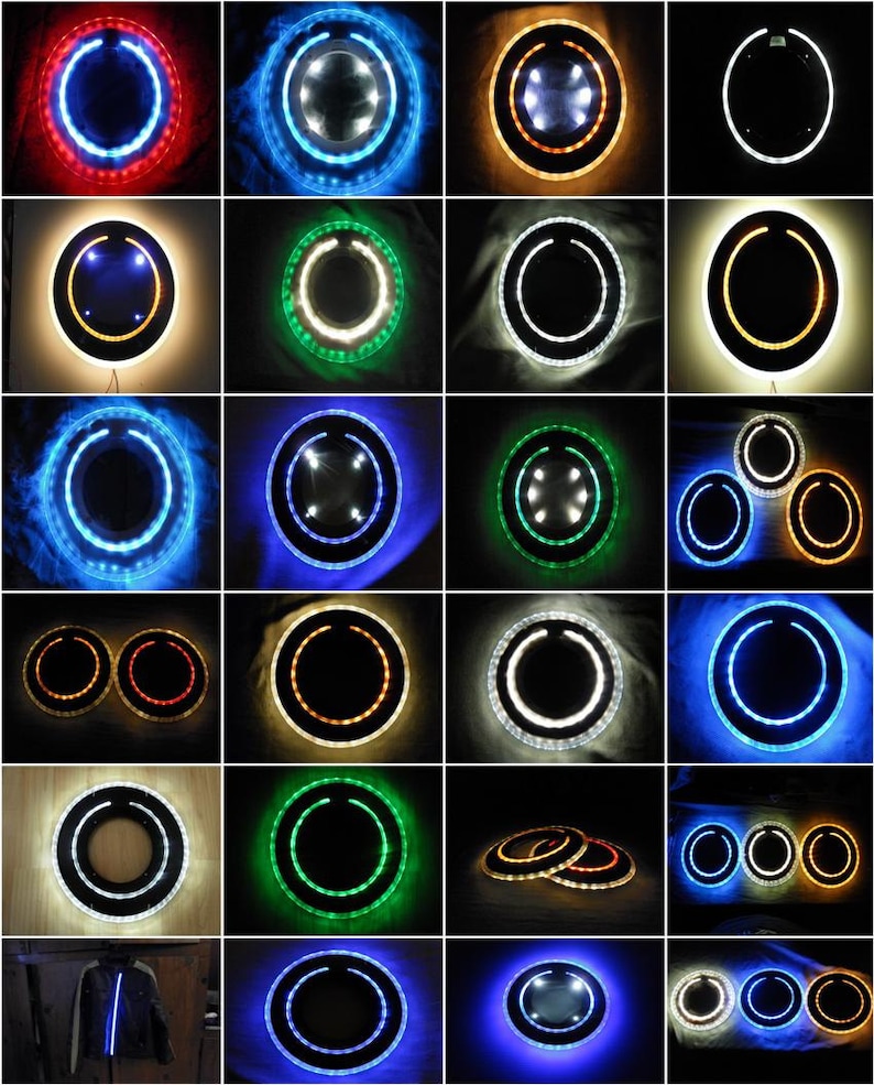 May include: A collection of round mirrors with different colored LED lights around the perimeter. The mirrors are various sizes and some have a double ring of lights.