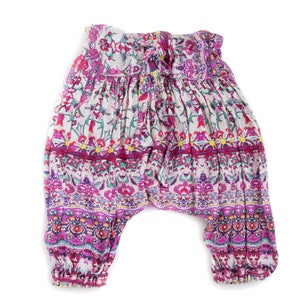 May include: White, pink, and purple patterned pants with a drawstring waist.