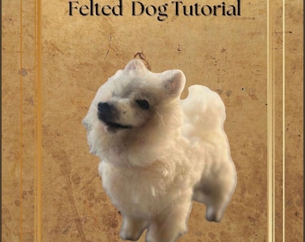 May include: A felted dog tutorial cover showing a cream-coloured, fluffy dog with a dark nose and eyes. The text "Felted Dog Tutorial" is displayed in a serif font. The background is a textured, brown surface with a gold border.