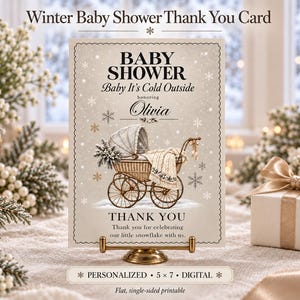 May include: A rectangular thank you card featuring a vintage-style baby carriage illustration, snowflakes, and the text: BABY SHOWER, Baby It's Cold Outside, honoring Olivia, THANK YOU, Thank you for celebrating our little snowflake with us.