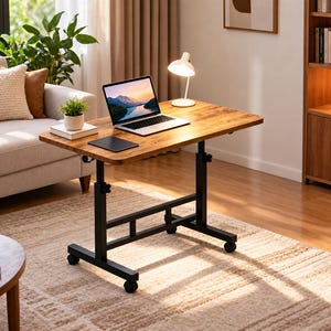 May include: A height-adjustable rolling desk with a rectangular brown wood-grain surface and a black metal frame. The desk features four caster wheels, two vertical support posts with adjustable knobs, and a horizontal crossbar for stability.