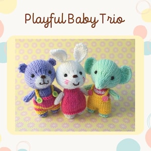 May include: A trio of knitted stuffed animals: a purple bear, a white bunny, and a green elephant. Each animal is wearing overalls with a button detail. The animals are sitting on a yellow background with a white floral pattern.