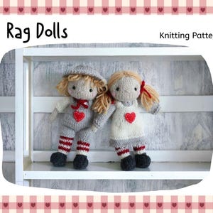May include: Two knitted rag dolls with blonde yarn hair, dressed in grey and white outfits with red heart details. One doll wears a hat, the other has pigtails. The image includes the text "Rag Dolls" and "Knitting Pattern".