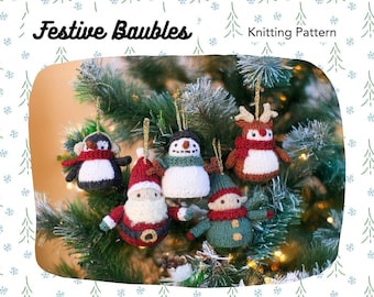 May include: A selection of knitted Christmas tree decorations, featuring a penguin, snowman, Santa, elf, and reindeer. The ornaments are crafted with red, white, black, and green yarn. The image includes the text "Festive Baubles" and "Knitting Pattern".