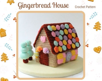 May include: Crochet gingerbread house pattern. The house is brown with a candy-colored roof and a candy cane door. There is a small green crochet tree in front of the house.