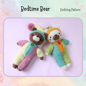 May include: Knitting pattern for a bedtime bear. Two knitted bears in pajamas, one brown and one white, are lying on a pink surface. The pattern is titled "Bedtime Bear".
