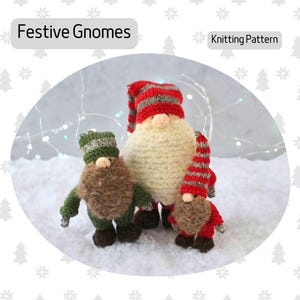 May include: Knitting pattern for three festive gnomes. The gnomes are wearing red and white striped hats and scarves, and green hats. The gnomes are standing on a white surface.