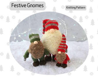 May include: Knitting pattern for three festive gnomes. The gnomes are wearing red and white striped hats and scarves, and green hats. The gnomes are standing on a white surface.