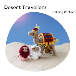 May include: Knitting pattern for a camel, a person wearing a red headscarf, and a person wearing a white headscarf. The camel is brown with a yellow, red, and blue saddle. The pattern is titled "Desert Travellers".